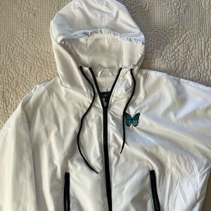 Women’s XL white cropped windbreaker with butterfly design. Great condition.